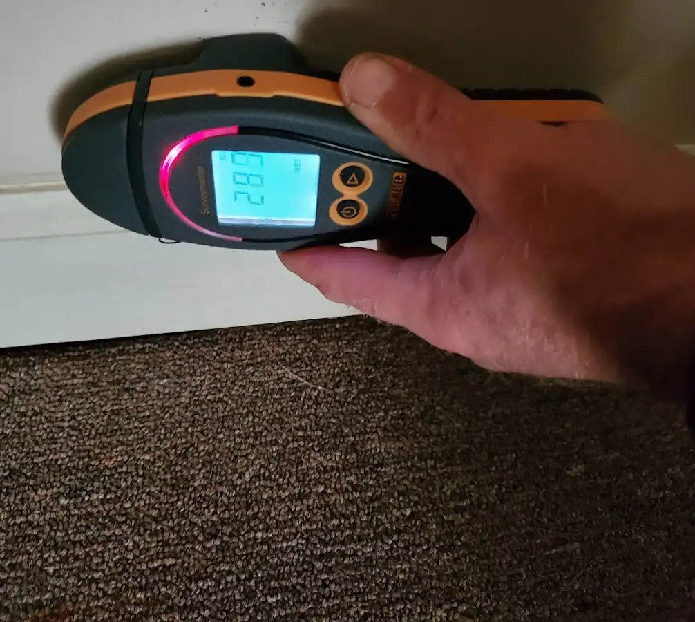 Moisture detection at baseboard during Storm Damage Restoration in Marlborough